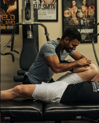 Coach Munir training a client